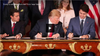 Trump signing NAFTA.png