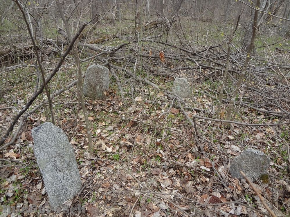 This cemetery had 8-10 burials (possibly more), many marked with smaller fieldstones and one flat marker.  It was 125' behind the double-chimney home.