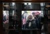 Protesters stand outside the Statehouse Atrium where reporters listen during the State of Ohio's Coronavirus response update on April 13, 2020 at the Ohio Statehouse in Columbus, Ohio. About 100 protesters assembled outside the building during Gov. Mike DeWine's weekday update on the state's response to the COVID-19 pandemic, upset that the state remains under a Stay-At-Home order and that non-essential businesses remain closed. (Joshua A. Bickel, Columbus Dispatch via USA TODAY NETWORK)