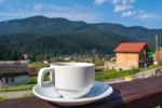 cup-tea-coffee-standing-porch-hotel-balcony-overlooking-mountains-early-morning-sunlight-123880698.jpg