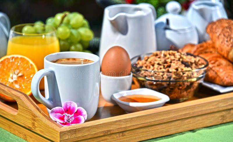 breakfast-served-coffee-juice-croissants-fruits-orange-cereals-garden-95336493.jpg