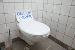 120820649-written-text-out-of-order-message-on-paper-over-toilet-bowl-in-bathroom.jpg