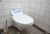 120820649-written-text-out-of-order-message-on-paper-over-toilet-bowl-in-bathroom.jpg