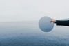 woman-holding-mirror-over-water-self-reflection-in-leadership-development-1024x683.jpg