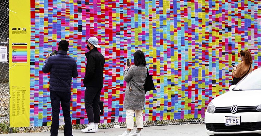 A massie mural featuring 20,000 of Trump's lies goes up in Soho