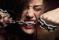 Woman-biting-chain