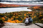 young-couple-hiking-in-mountain-and-relaxing-royalty-free-image-621242410-1567024892.jpg