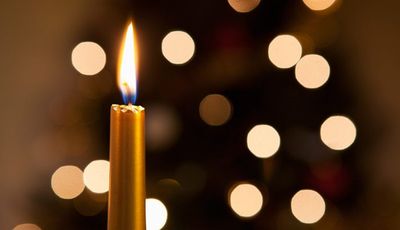 1140-candle-lights-holiday-grief-family.imgcache.rev.web.700.403.jpg