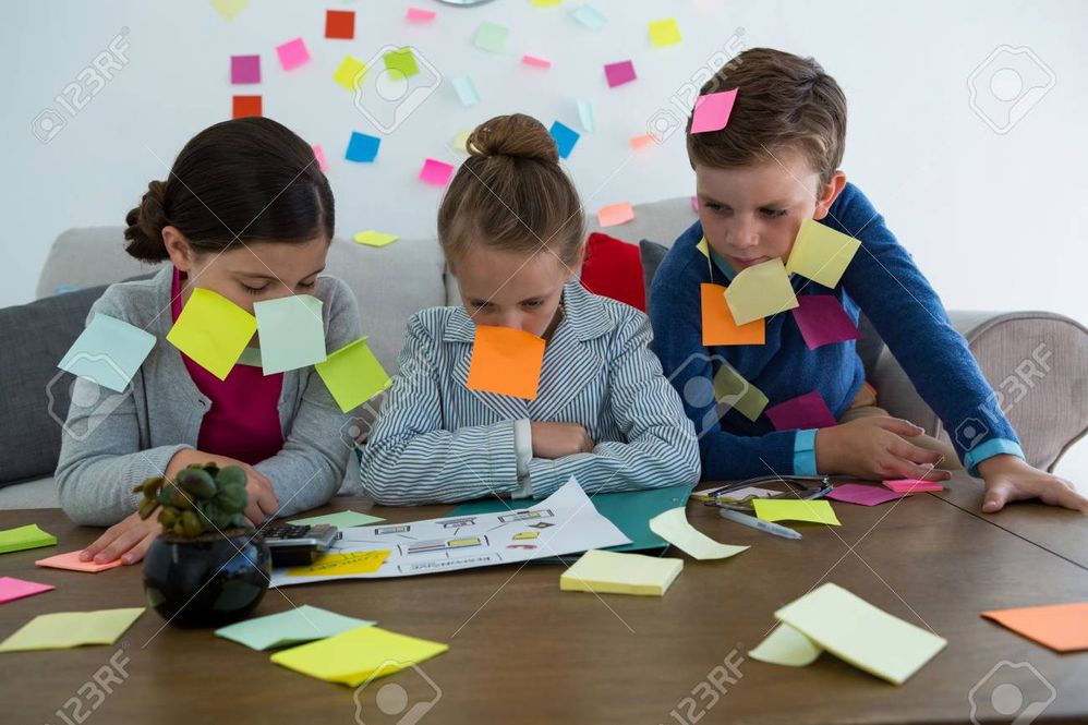 83441524-kids-as-business-executives-playing-with-sticky-notes-in-office.jpg