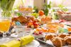93561821-breakfast-or-brunch-table-filled-with-all-sorts-of-delicious-delicatessen-ready-for-an-easter-meal-.jpg