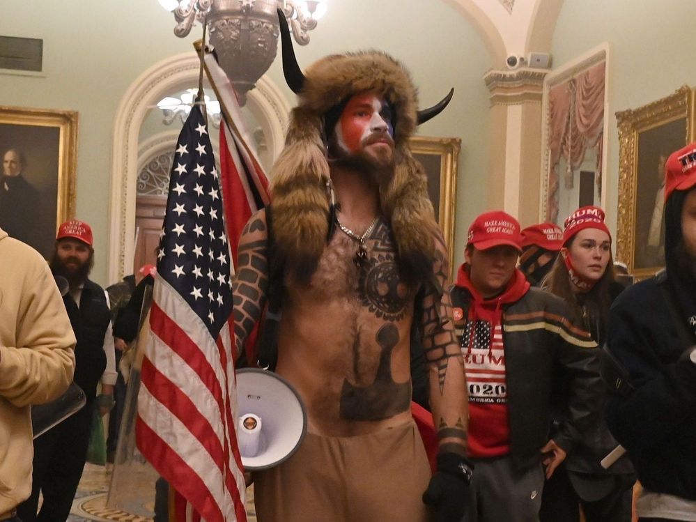 The self-professed 'QAnon shaman' from Arizona.  Being held without bail.