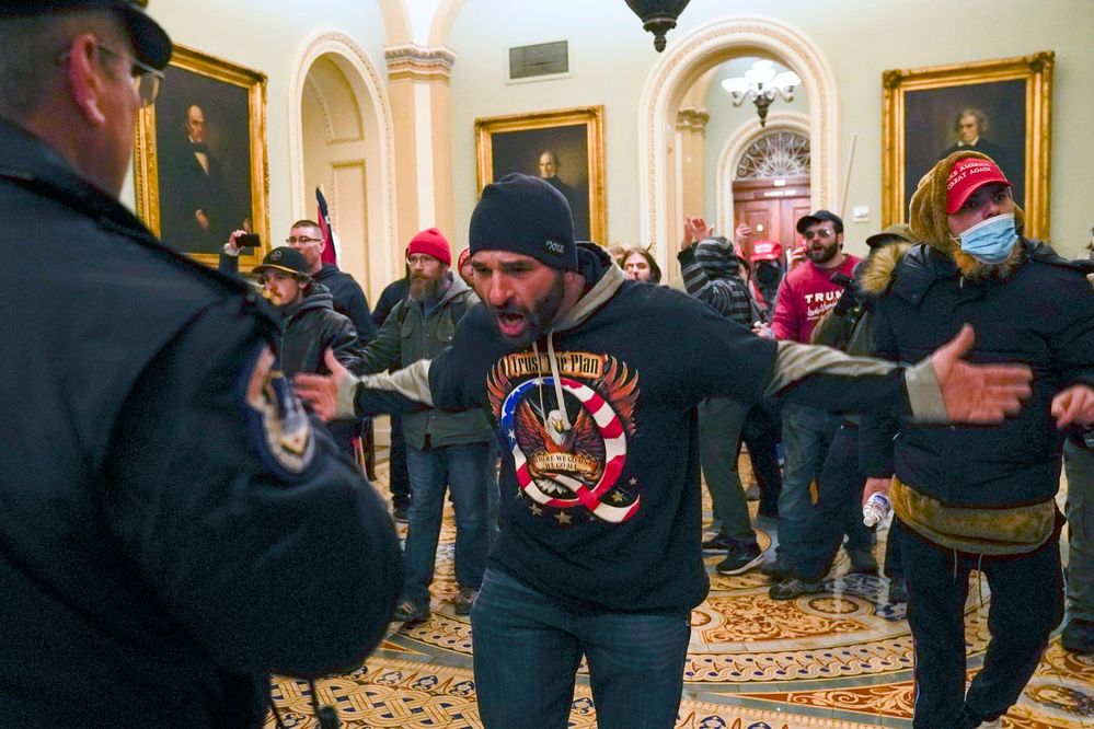 Arrested sporting his QAnon shirt.  From Iowa.