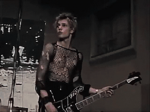 paul-simonon-the-clash (AARP police and thieves) - Copy.gif