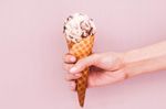 young-woman-is-holding-an-ice-cream-on-an-ice-cream-royalty-free-image-1032703148-1559589761.jpg