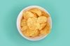 close-up-of-potato-chips-in-bowl-on-turquoise-royalty-free-image-1077717982-1559589852.jpg